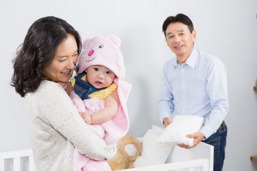 Happy family with baby at home