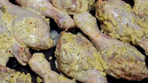 Grill.BBQ.Kebabs from chicken fillet.Dietary poultry meat.Preparation for a barbecue.Red poultry.Homemade recipes,cooking at home is delicious.Chicken shins.Chicken meat.Chicken legs in garlic sauce.