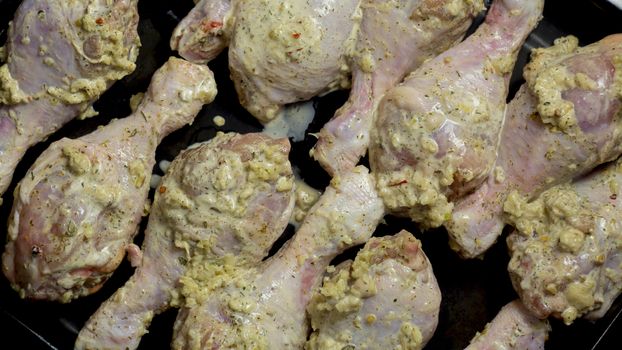 Dietary poultry meat.Preparation for a barbecue.Red poultry.Homemade recipes,cooking at home is delicious.Chicken shins.Chicken meat.Chicken legs in garlic sauce.Grill.BBQ.Kebabs from chicken fillet.