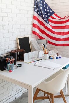 Artist desk and workspace with the US flag. The Us Independence Day