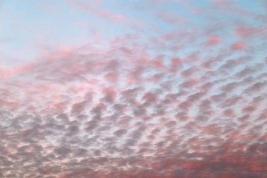 Beautiful panorama of orange and yellow clouds at sunrise and sunset in a blue sky