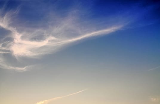 Beautiful panorama of orange and yellow clouds at sunrise and sunset in a blue sky