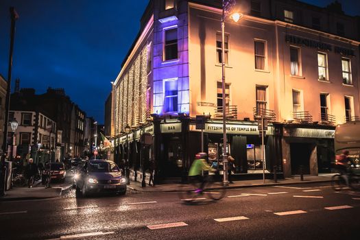 Dublin, Ireland - February 12, 2019: Night street atmosphere in the streets of the historic center where people walk on a winter day