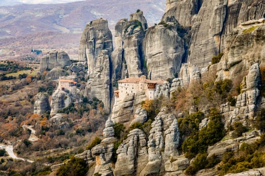 The Holy Monastery of Roussanou and Monastery of Agios Nikolaos Anapafsas  situated on the steep cliffs, mountains panorama, Kalampaka, Trikala, Thessaly, Greece