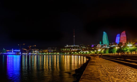 View from Caspian sea shore to the central business district with skyscrapers and tv tower, Baku, Azerbaijan