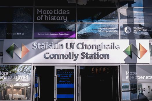 Dublin, Ireland - February 15, 2019: Passengers walking past the entrance to Connolly DART train station (Staisiun ui Chonghaile) on a winter day