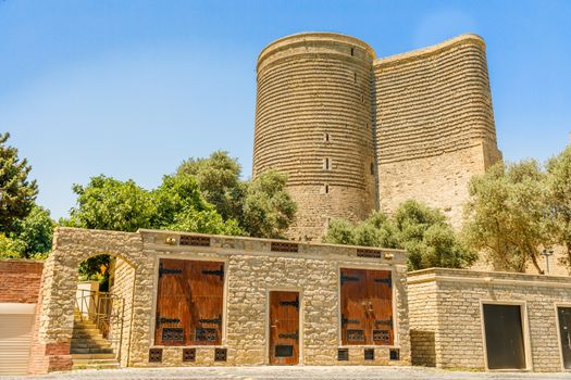 Azerbaijani stone buildings with  Gız Galası medieval Maiden tower, old town, Baku, Azerbaijan