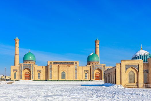 Snow and blue domes and minarets of Hazrati Imam complex, religious center of Tashkent, Uzbekistan