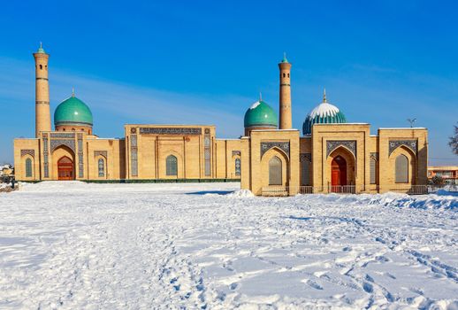 Snow and blue domes and minarets of Hazrati Imam complex, religious center of Tashkent, Uzbekistan