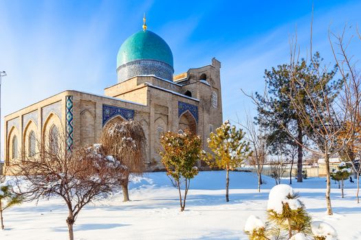 Snow, blue domes and ornated mosques and minarets of Hazrati Imam complex, religious center of Tashkent, Uzbekistan