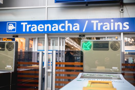 Dublin, Ireland - February 15, 2019: Detail view of an entry ticket validation machine on the platform of Connolly DART train station (Staisiun ui Chonghaile) on a winter day