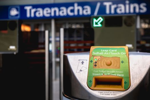 Dublin, Ireland - February 15, 2019: Detail view of an entry ticket validation machine on the platform of Connolly DART train station (Staisiun ui Chonghaile) on a winter day