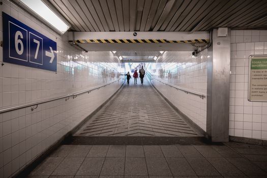 Dublin, Ireland - February 15, 2019: Access tunnel to platforms 6 and 7 in the Connolly DART train station (Staisiun ui Chonghaile) on a winter day