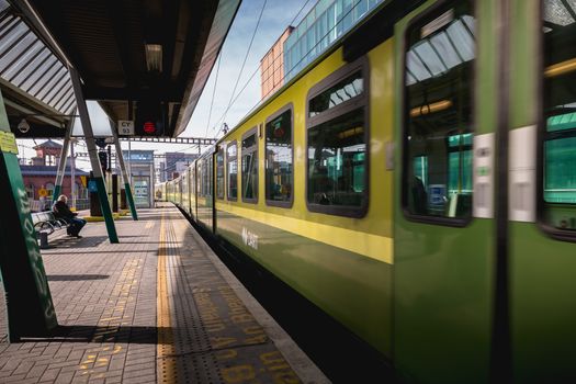 Dublin, Ireland - February 15, 2019: Passengers walking on the platform of Connolly DART train station (Staisiun ui Chonghaile) on a winter day