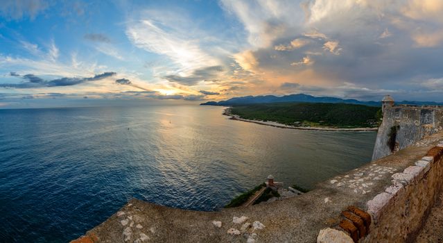 San Pedro de La Roca fort walls with towers, Caribbean sea sunset view, Santiago De Cuba, Cuba