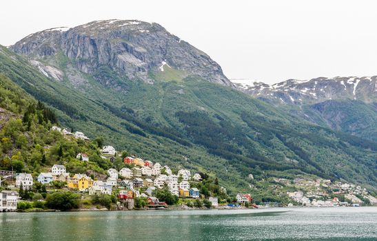 Colorful norwegian residential houses on the hill of Sorfjord, Odda, Hordaland county, Norway