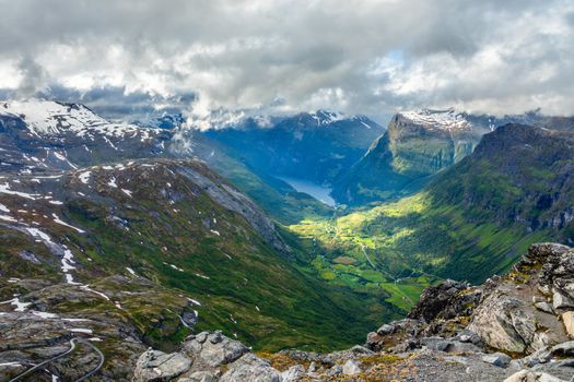 View to the Geiranger fjord with green valley surrounded by mountains, Geiranger, Sunnmore region, More og Romsdal county, Norway