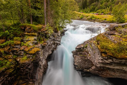 Gudbrandsjuvet ravine and Valldola river running through with waterfall, Valldal, Norway