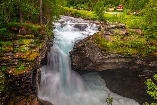 Gudbrandsjuvet ravine and Valldola river running through with waterfall, Valldal, Norway