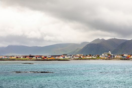 Andenes village panorama with multiple houses and mountains in the background, Lofoten islands, Andoy Municipality, Vesteralen district, Nordland county, Norway