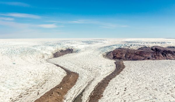 Greenlandic melting ice sheet glacier aerial view from the plane, near Kangerlussuaq, Greenland