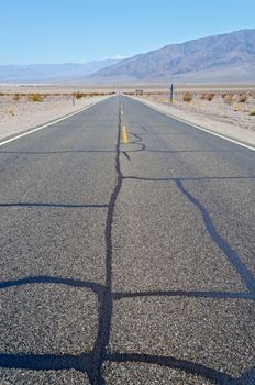Hot desert road in Death Valley National Park, California, USA