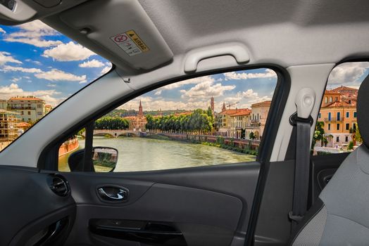 Looking through a car window with view over Adige River in central Verona, Italy