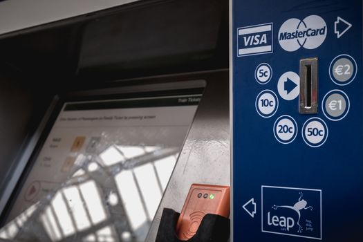 Dublin, Ireland - February 15, 2019: Automatic ticket purchase machine in Connolly DART train station (Staisiun ui Chonghaile) on a winter day