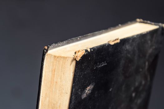 The binding of an old book in black cover.