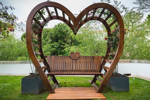 Alcobaca, Portugal - April 13, 2019: detail view on the heart decorated benches of the garden of love on a spring day
