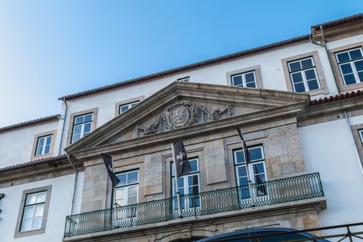 Porto, Portugal - November 30, 2018: Storefront and architectural detail of District - Offices and Lifestyle, a co working space in the historic city center on a winter day