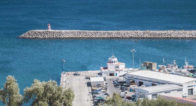 Sesimbra, Portugal - August 08, 2018: View of the Maritme police station at the entrance to the port on a summer day