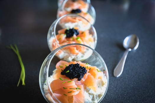 verrine salmon lumpfish egg fresh cheese and avocado bed in the kitchen