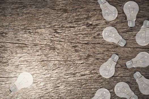 Light Bulbs Concept Wood Grain Background