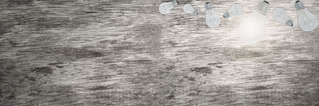 Light Bulbs Concept Wood Grain Background