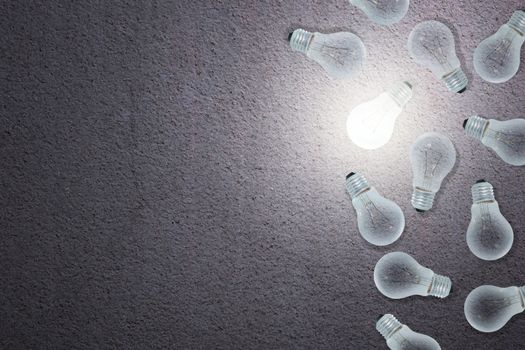 Light Bulbs Concept gray cement background