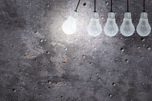 Light Bulbs Concept gray cement background