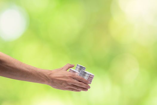 Hand catching money  scene background bokeh green