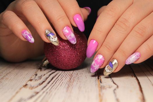 Closeup photo of a beautiful female hands with elegant manicure and diamond rings.