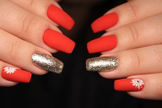 Beautiful woman's nails with beautiful christmas manicure studio