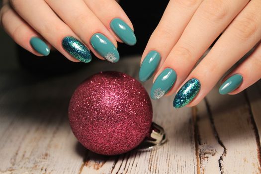 Beautiful woman's nails with beautiful christmas manicure studio