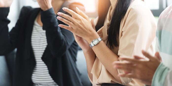 Close up Group of People applauding in a meeting of classroom. Businessman, Businesswoman in a seminar of conference room. Banner, Panoramic.