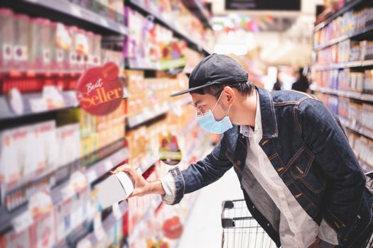 Asian men buy and shopping food  for hoarding in during the Covid outbreak