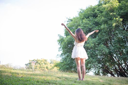 Beautiful woman outside at nature park,Free Happy Woman Enjoying Nature,Freedom concept.