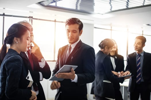 Group of Business People using tablet for Meeting Discussion Working Concept in meeting room