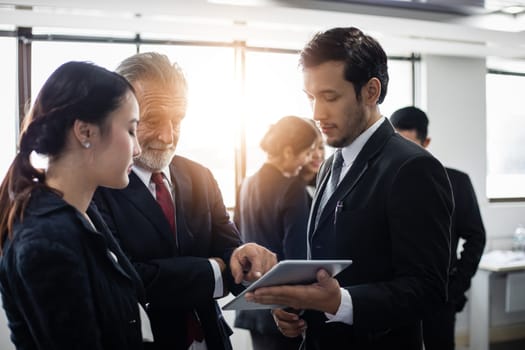 Group of Business People using tablet for Meeting Discussion Working Concept in meeting room