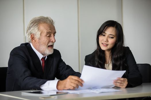 businessmen holding documents for business partners discussing  and share ideas at meeting and business women smiling happy for working