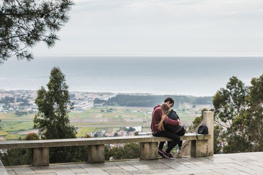 Vila Cha near Esposende - May 9, 2018: couple enjoying the panoramic view of Esposende on the entrance to the chapel of S. Lourenco on a spring day