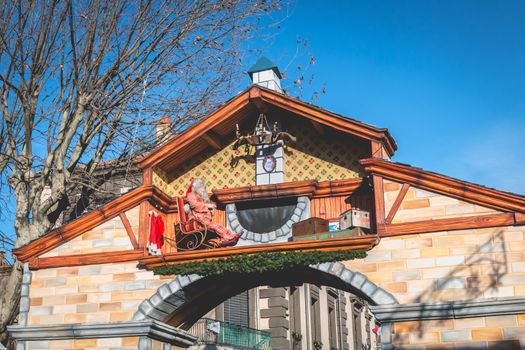 Marseillan, France - December 30, 2018: Santa Claus door mounted in the historic city center for the end of year and Christmas holidays