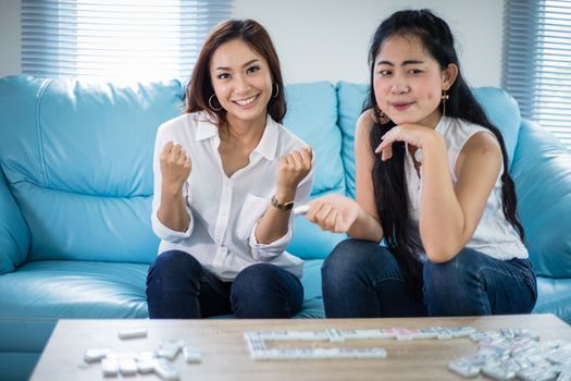 lifestyle portrait Asian women of best friends - smiling happy on sofa at living room